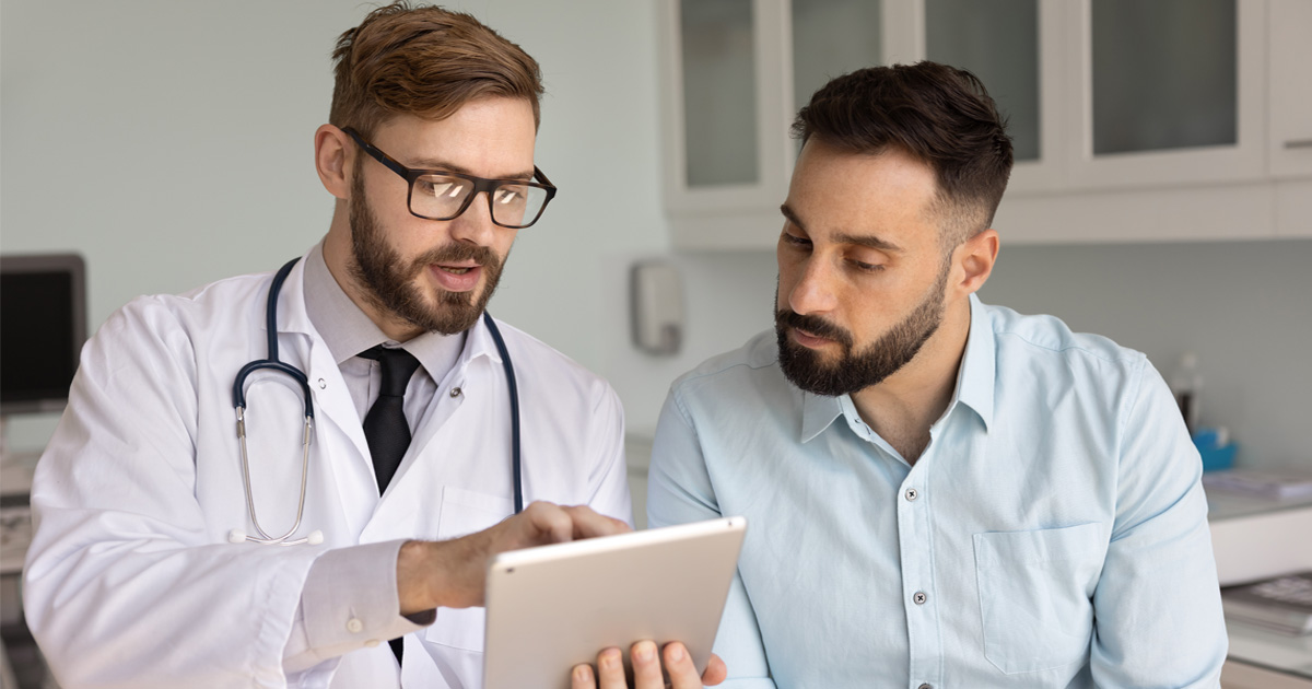 Clinician reviewing hormone treatment plan for Testosterone Therapy for Men in Sacramento CA